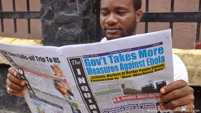 Newspaper reader in Liberia