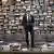 With a backdrop of hundreds of books, Lagerfeld poses in his studio