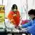 A woman buys an antigen tests in Jiangsu province.