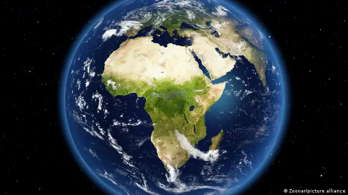 View on earth from space with the African continent in the center, parts of Europe and Asia from space.