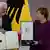 Frank-Walter Steinmeier e Angela Merkel