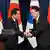 South Korean President Yoon Suk Yeol shakes hands with Japanese Prime Minister Fumio Kishida during a joint press conference after their meeting at the presidential office in Seoul on May 7