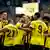 Borussia Dortmund players in yellow celebrate