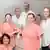 Doctors and nurses dressed in white and pink