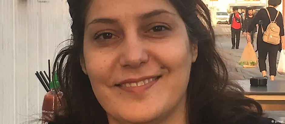Close-up portrait of a smiling, dark-haired Ghazaleh Zarea 