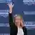 Italian Prime Minister Giorgia Meloni waves to supporters