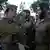 صور أرشيف: مقاتلون يهود متشددون من كتيبة "نيتساح يهودا" في الجيش الإسرائيلي خلال مراسم أدائهم اليمين بالقدس 26 / 05 / 2013.